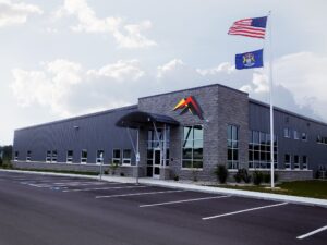 Impact Label headquarters and manufacturing facility in Galesburg, Michigan with US and Michigan flags