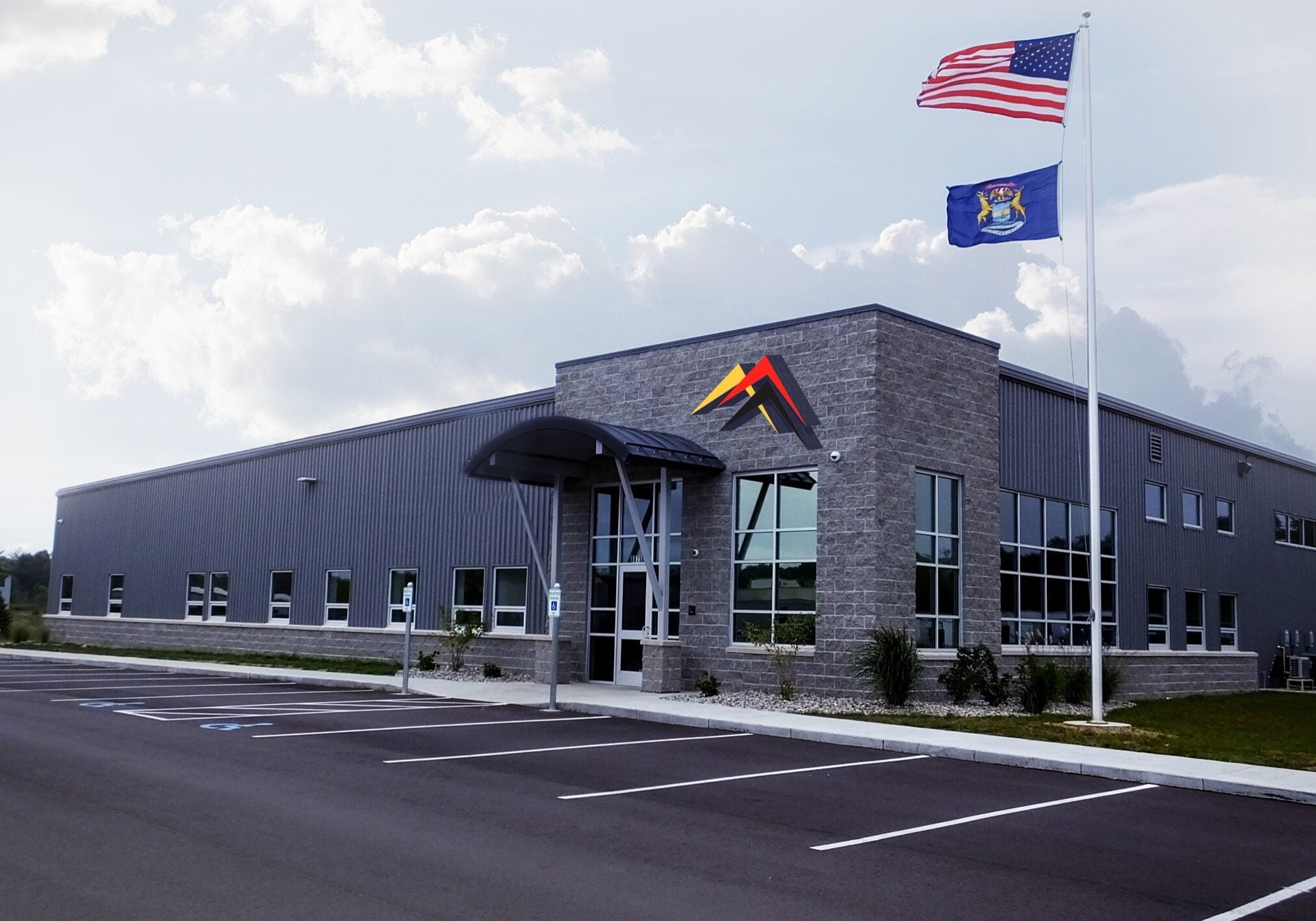 Impact Label headquarters and manufacturing facility in Galesburg, Michigan with US and Michigan flags